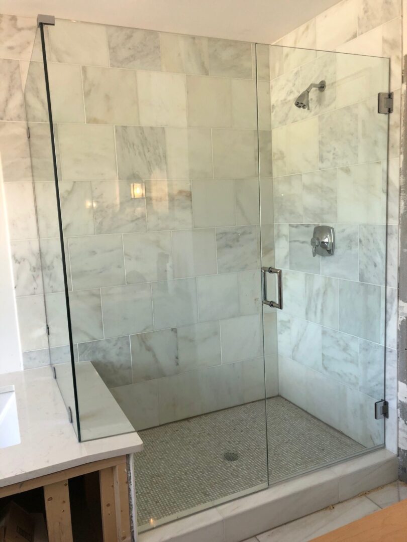 A bathroom with marble walls and floors
